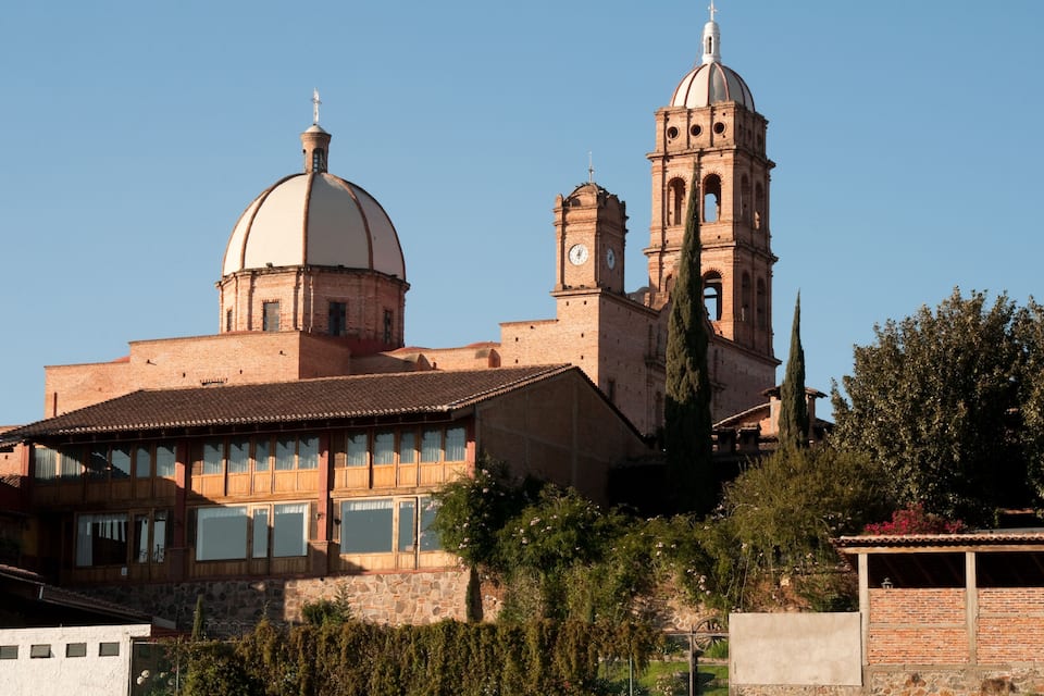 A historic building with a large dome and a bell tower.
