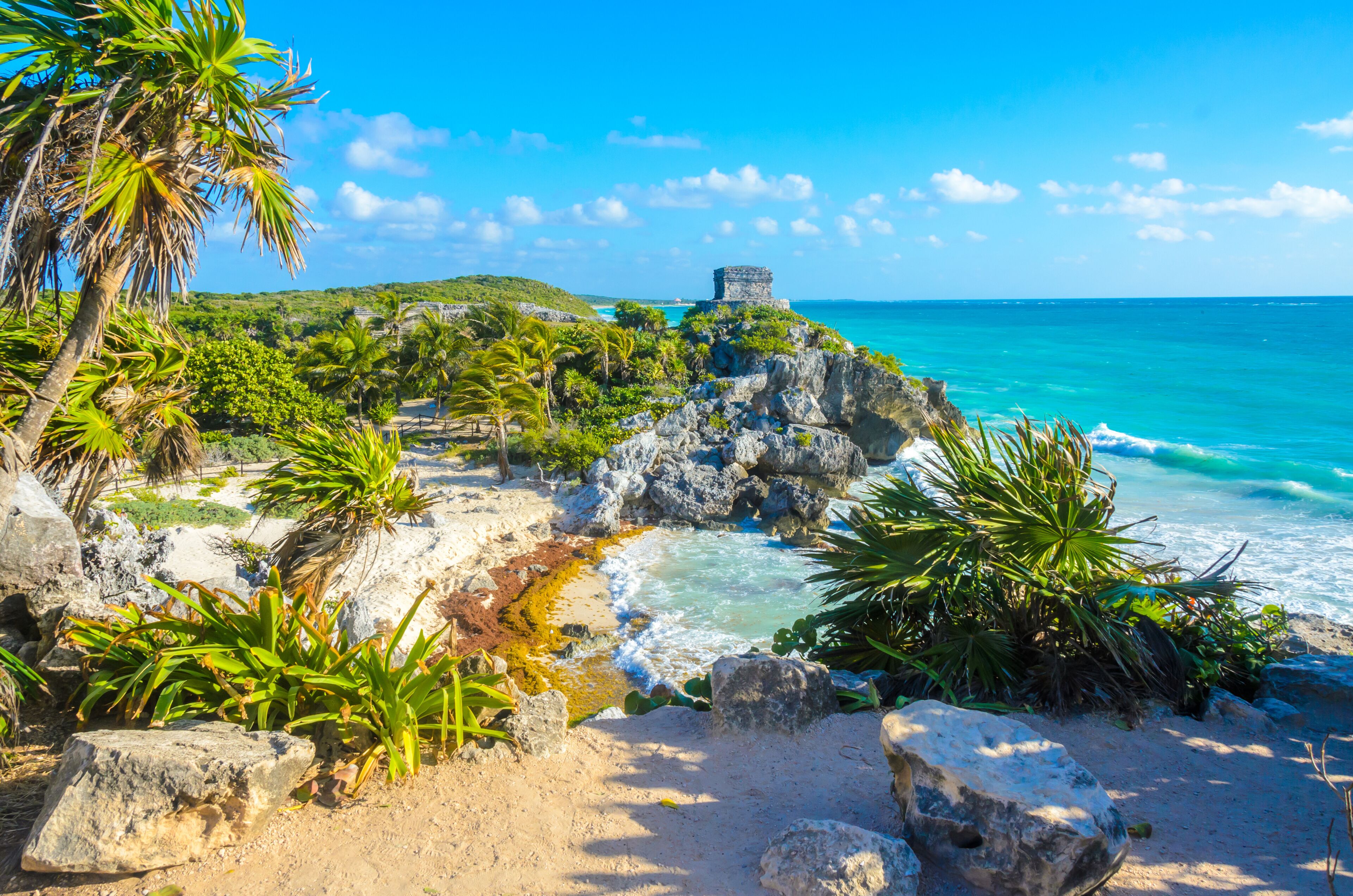 Mayan ruins of Tulum at tropical coast. God of Winds Temple at paradise beach. Mayan ruins of Tulum, Quintana Roo, Mexico.