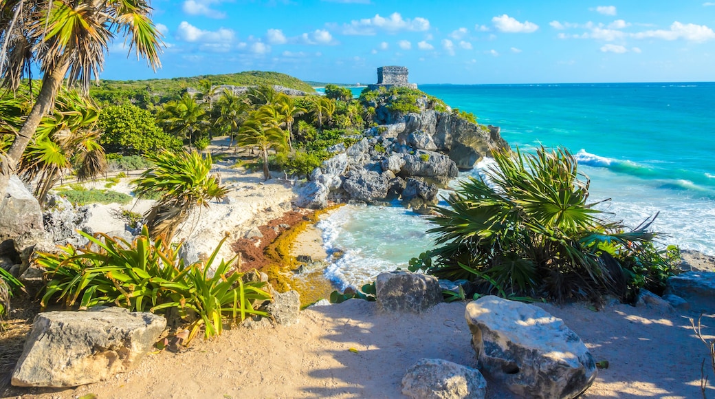 Mayan ruins of Tulum at tropical coast. God of Winds Temple at paradise beach. Mayan ruins of Tulum, Quintana Roo, Mexico.