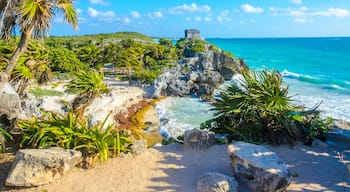 Mayan ruins of Tulum at tropical coast. God of Winds Temple at paradise beach. Mayan ruins of Tulum, Quintana Roo, Mexico.