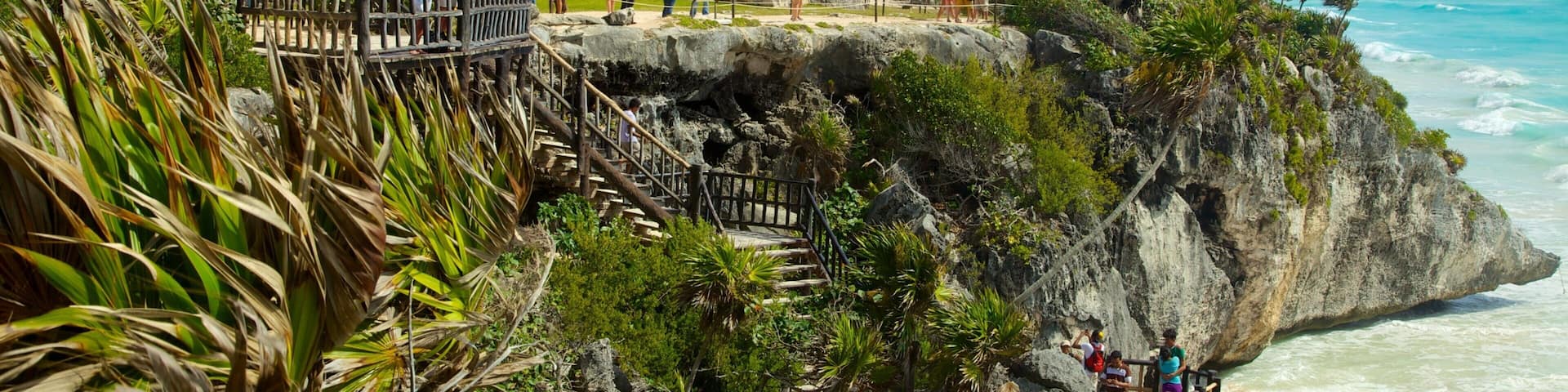 Tulum Mayan Ruins which includes building ruins, general coastal views and rugged coastline