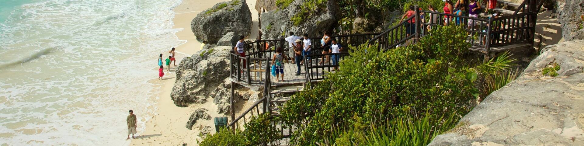 Tulum Mayan Ruins featuring tropical scenes and rocky coastline