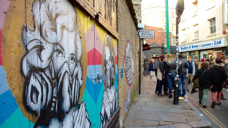 Brick Lane which includes street scenes, markets and outdoor art