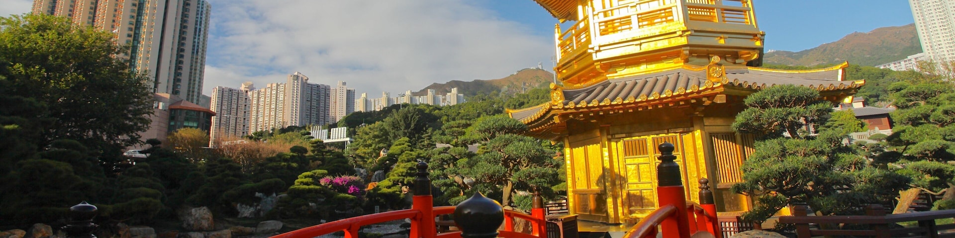 A traditional Chinese pagoda with a red bridge in the foreground.