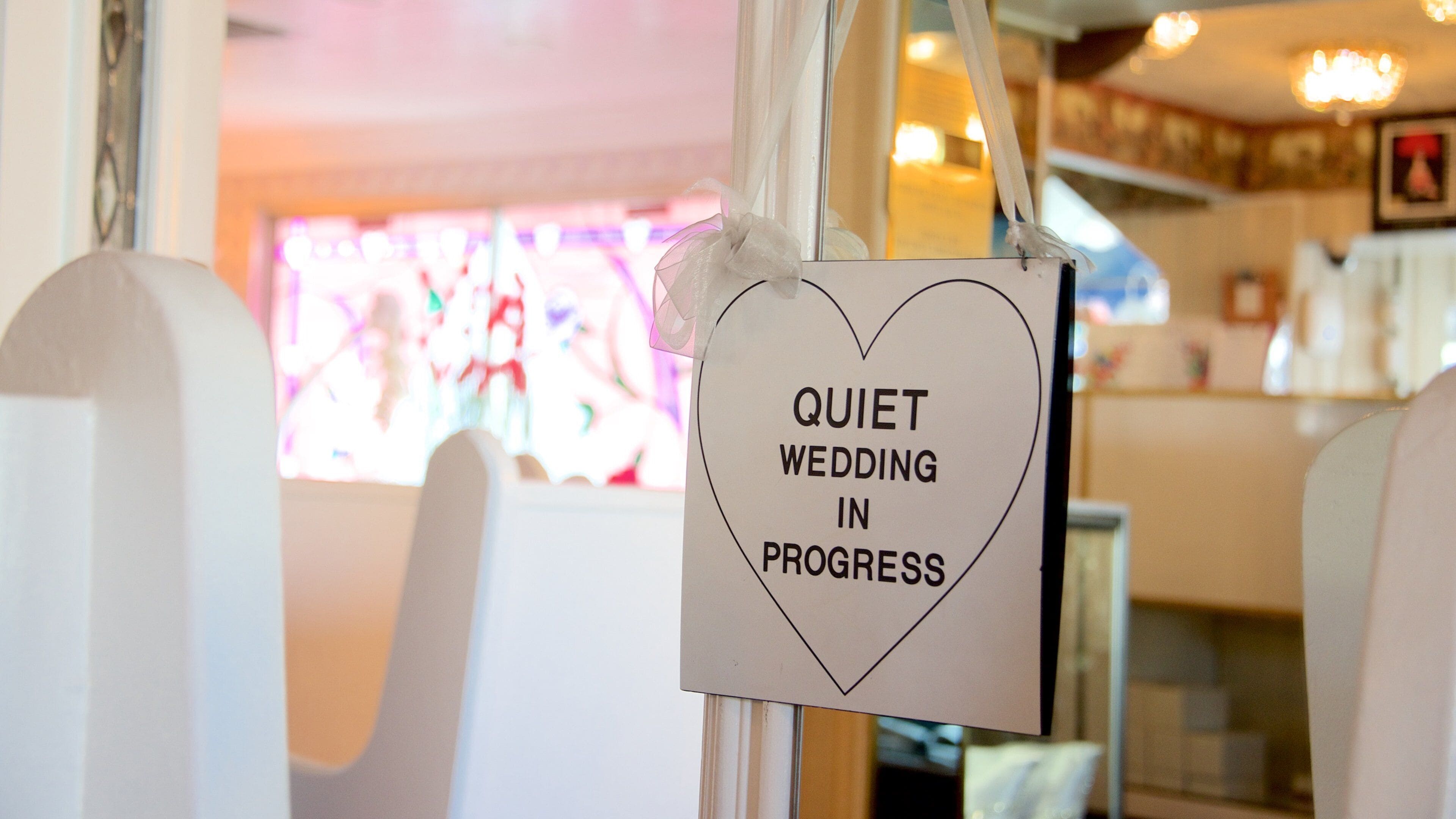 Little White Wedding Chapel which includes interior views and signage