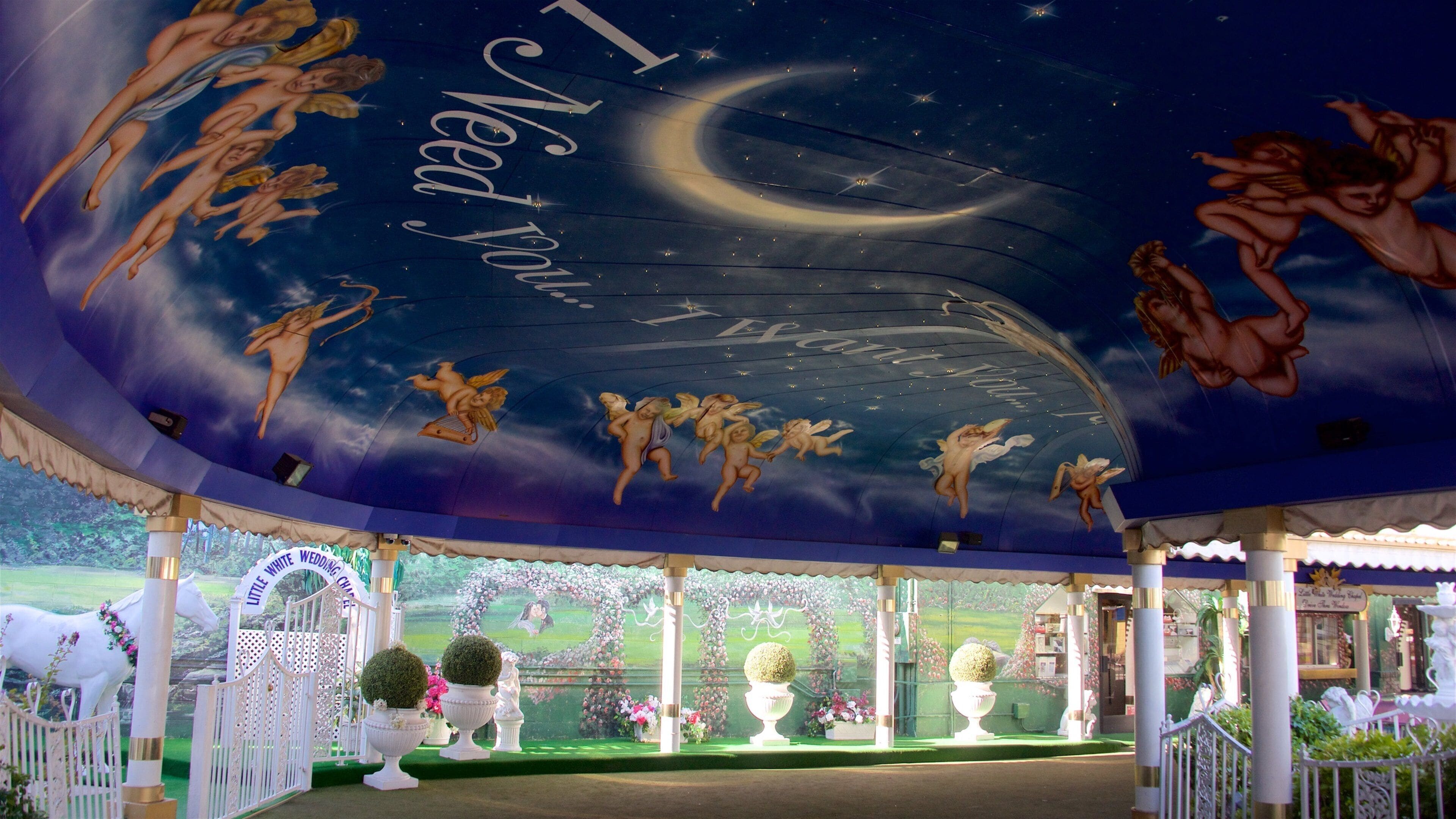 Little White Wedding Chapel showing interior views and art