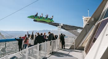 Stratosphere Tower featuring rides and views as well as a small group of people