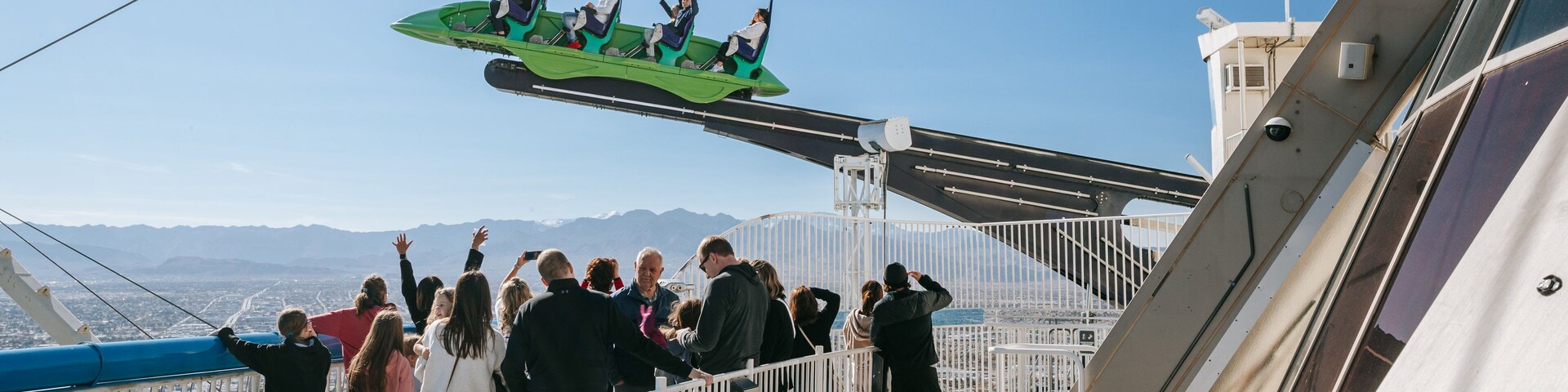 Stratosphere Tower featuring rides and views as well as a small group of people