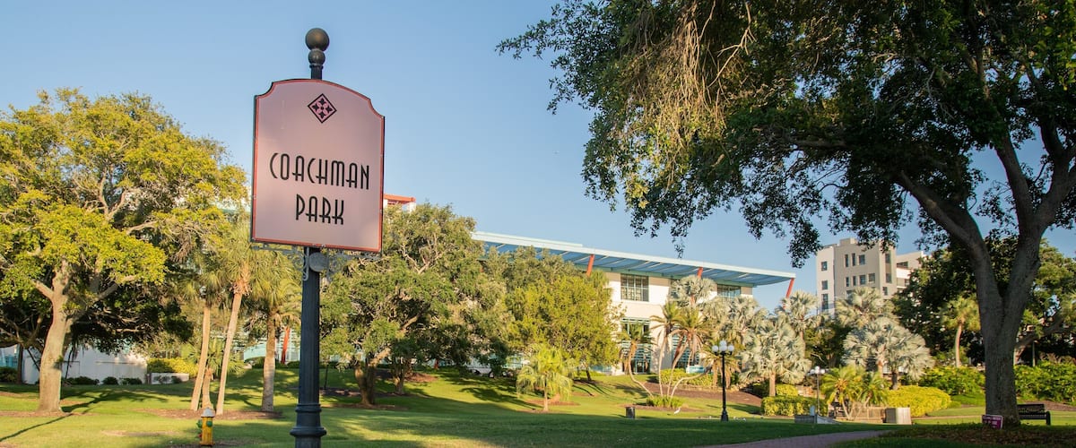 Coachman Park showing signage and a park
