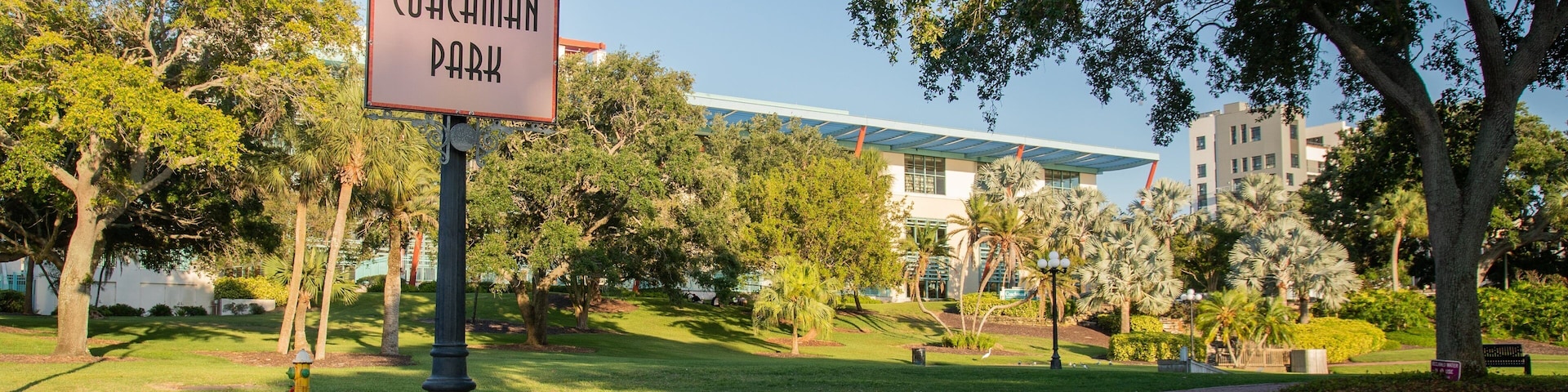 Coachman Park showing signage and a park