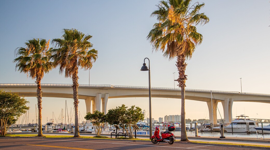 Coachman Park showing a bridge, a sunset and a bay or harbor