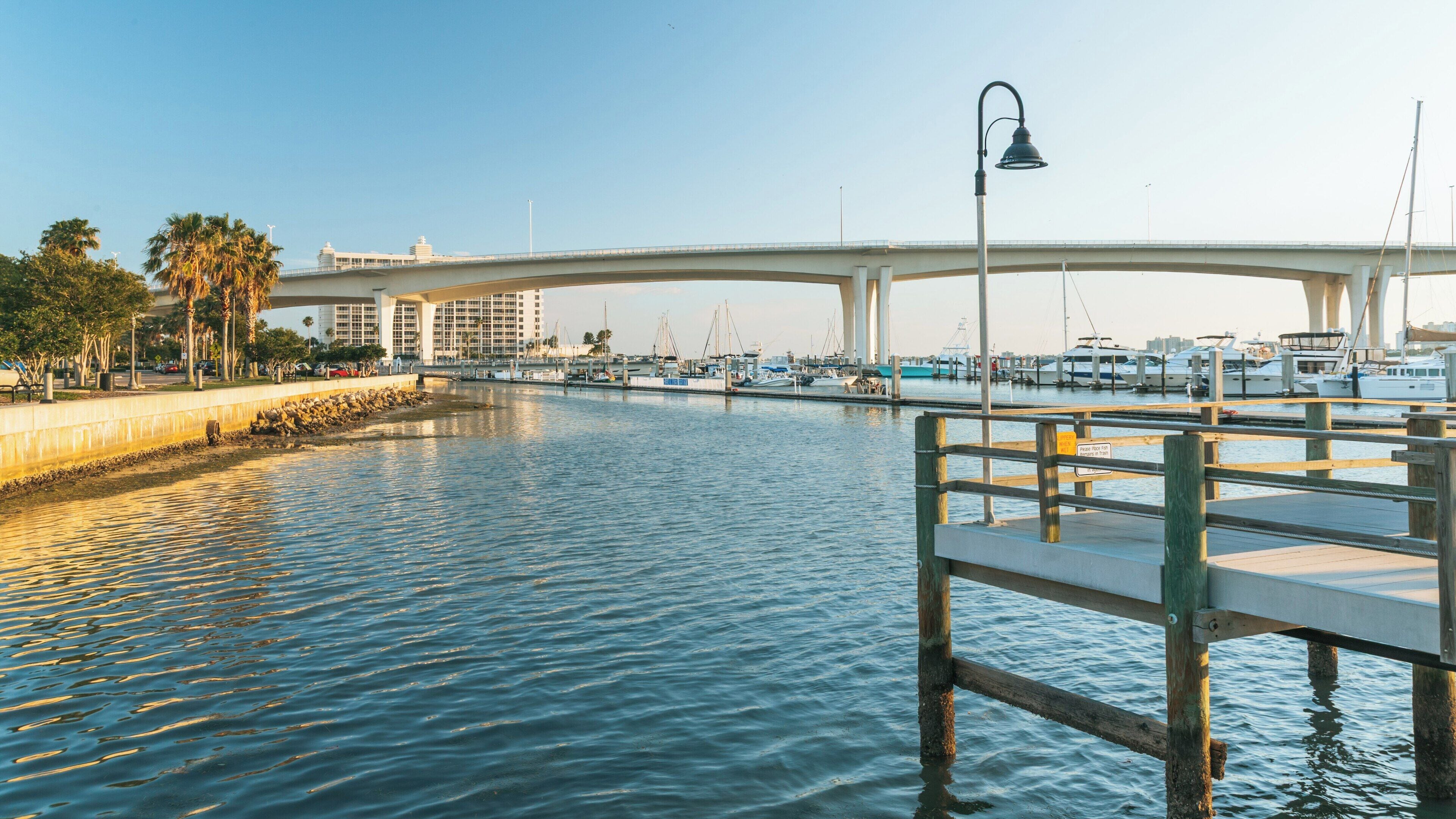 Scenic view of Coachman Park in Clearwater, Florida showcasing the waterfront and marina during golden hour
