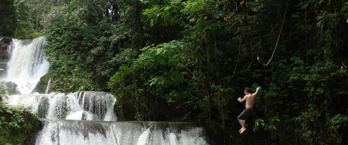 YS Falls showing a cascade as well as an individual male