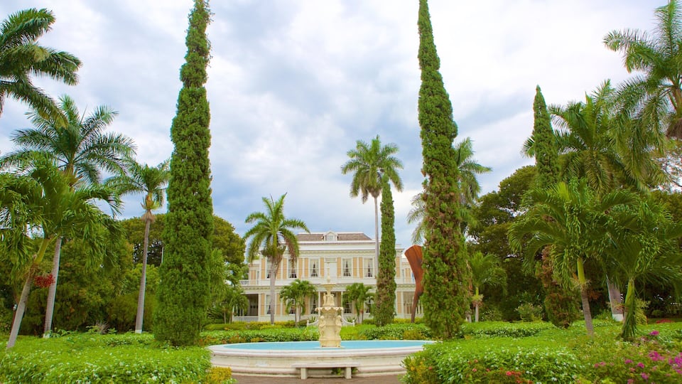 Devon House featuring a garden, a fountain and a house