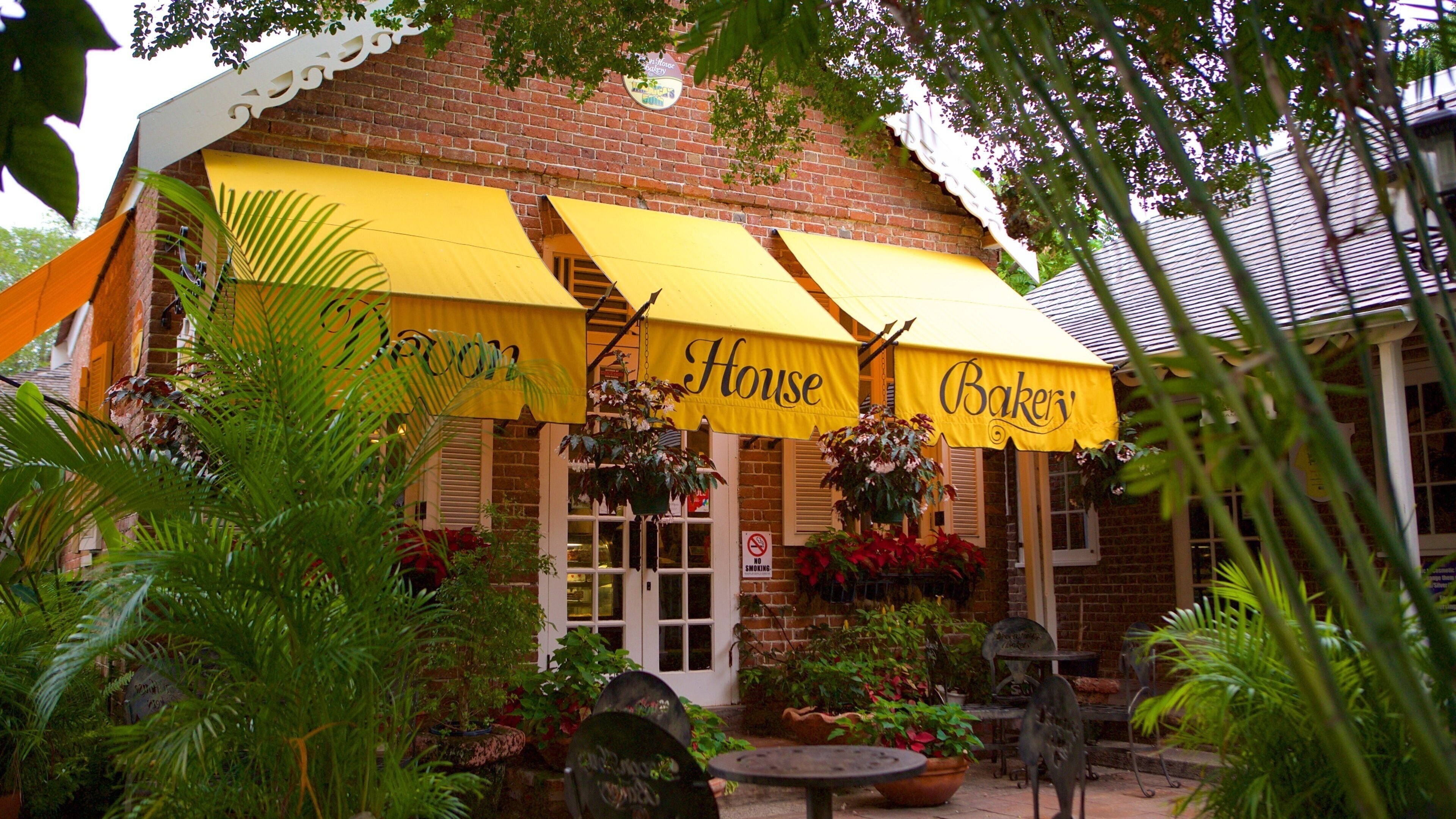 A brick building with yellow awnings labeled "House Bakery."