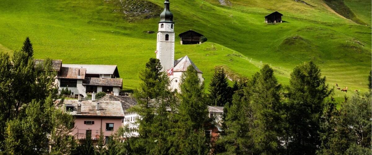 The 9,752' (2,973m) Teurihorn looms over the village of Splügen. With well-marked trails throughout the country and backcountry huts, Switzerland is a great hiking destination. #mysummervacation #lifeatexpedia #hiking #mountains #Switzerland