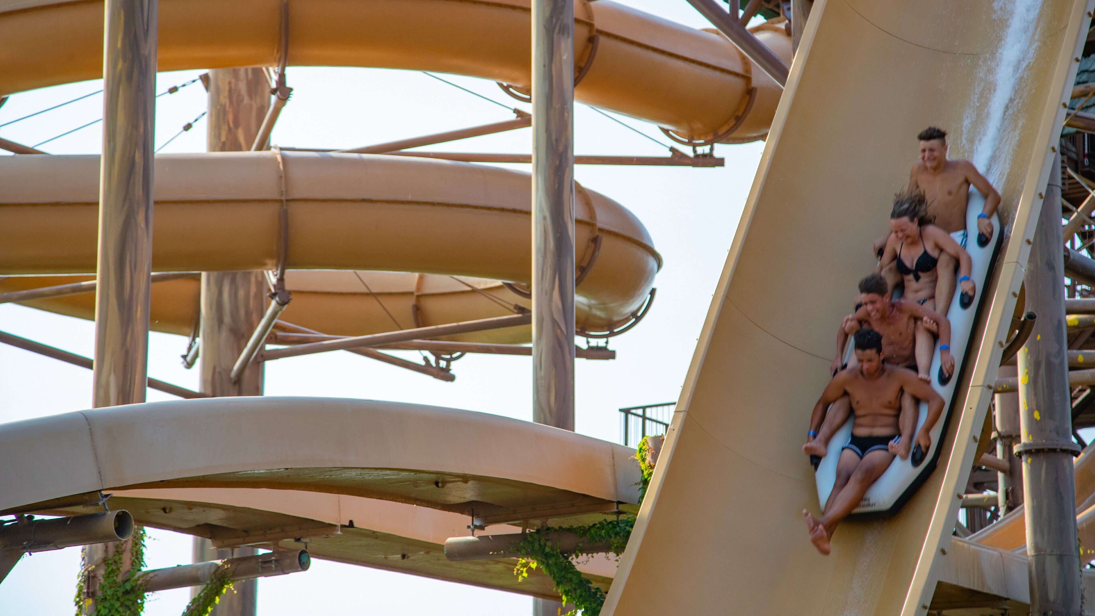 Aqualandia featuring a waterpark as well as a small group of people