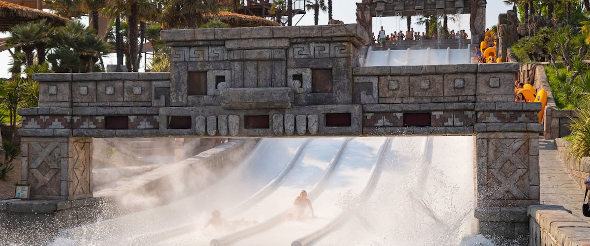 Aqualandia featuring a waterpark as well as an individual male