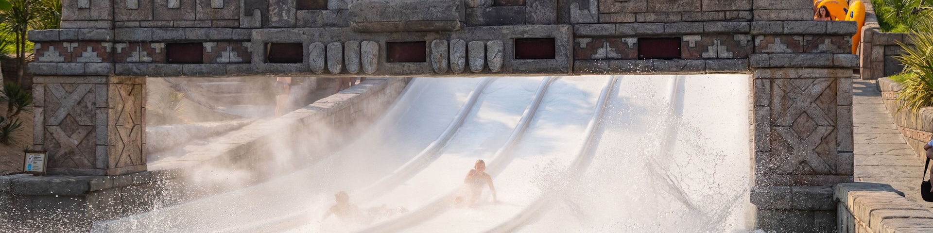 Aqualandia featuring a waterpark as well as an individual male