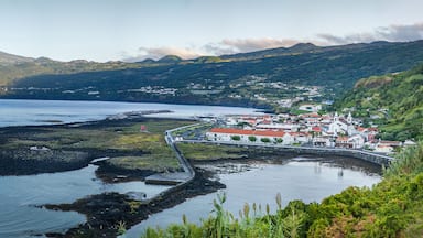 Panoramic view of Fishing village Lajes do Pico with Volcano Mount Pico in background in morning light, Pico Island - Azores