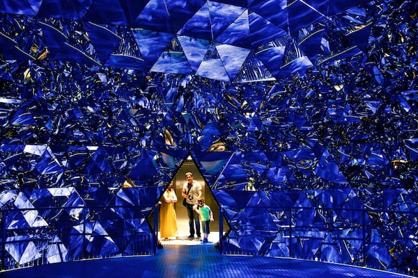 Swarowski Crystal Worlds showing interior views as well as a family