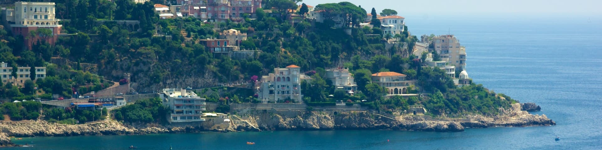 Castle Hill showing a lighthouse, a coastal town and rugged coastline