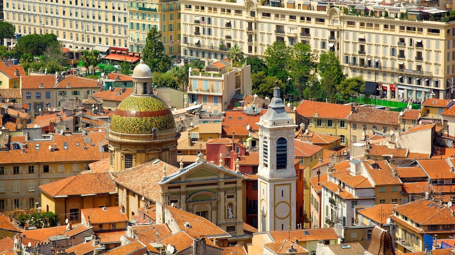 A densely packed urban area with historic buildings, a prominent dome, and a church with a bell tower.
