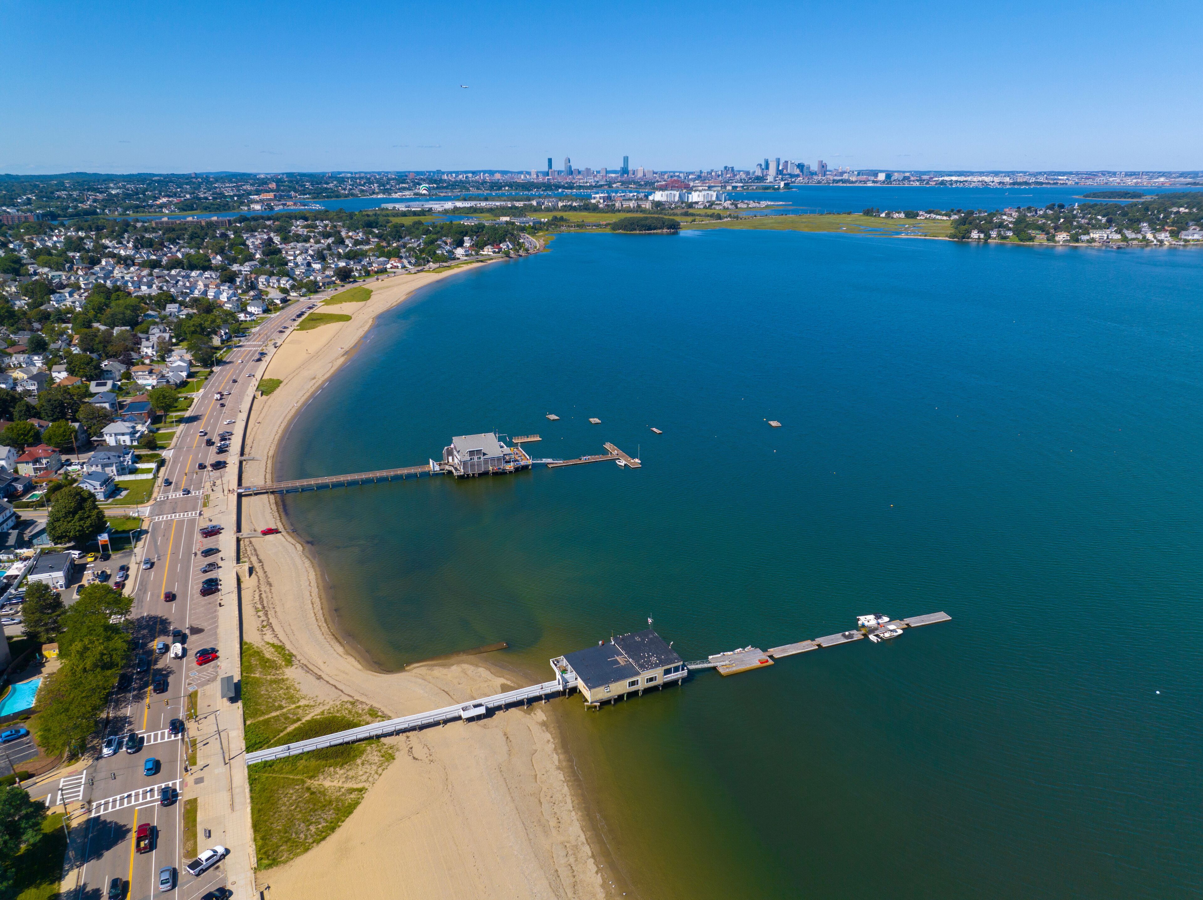 Wollaston Beach aerial view with Squantum and Wollaston Yacht Club with Boston city skyline in Wollaston, city of Quincy, Massachusetts MA, USA. 