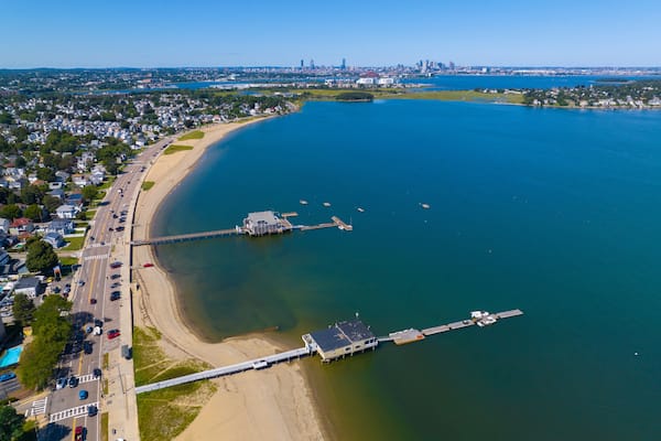 Wollaston Beach aerial view with Squantum and Wollaston Yacht Club with Boston city skyline in Wollaston, city of Quincy, Massachusetts MA, USA.