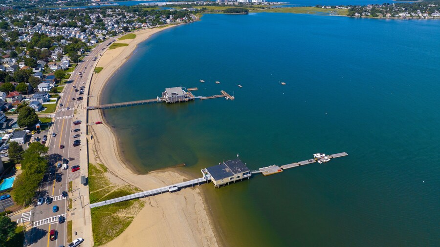 Wollaston Beach aerial view with Squantum and Wollaston Yacht Club with Boston city skyline in Wollaston, city of Quincy, Massachusetts MA, USA.