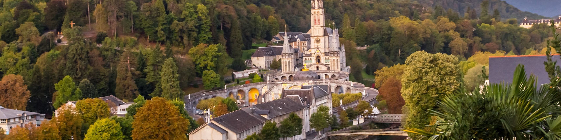 Pilgrimage Center. Sanctuary in Lourdes. Shrine in France. Way of St. James. Notre Dame de Lourdes. Catholic Basilica. Stone church. Saint Bernadette. Nun Bernadette Soubirous.