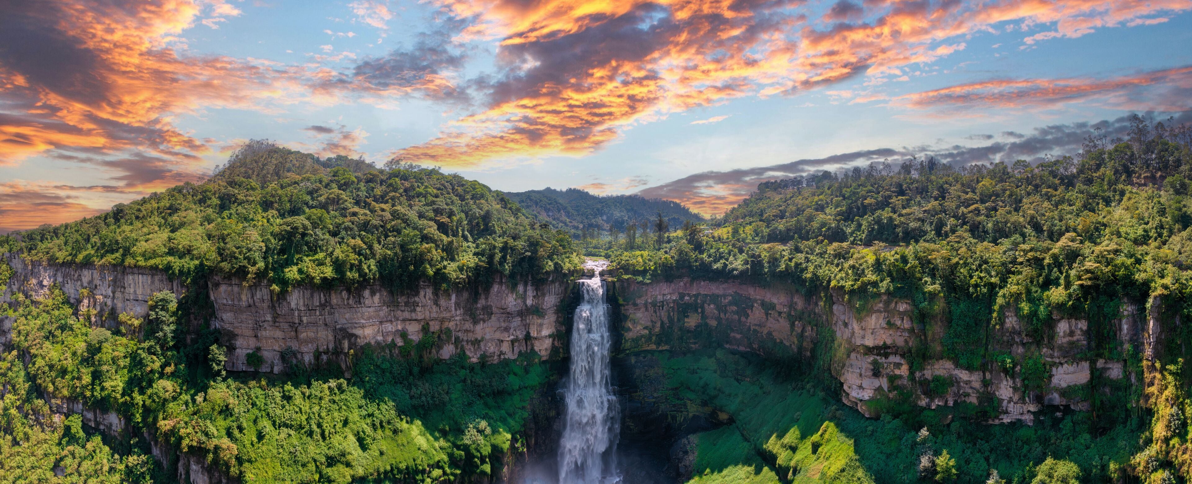 Aerial panoramic view of the El Salto de Tequendama, one of the most imposing waterfalls in Colombia amazing sunset