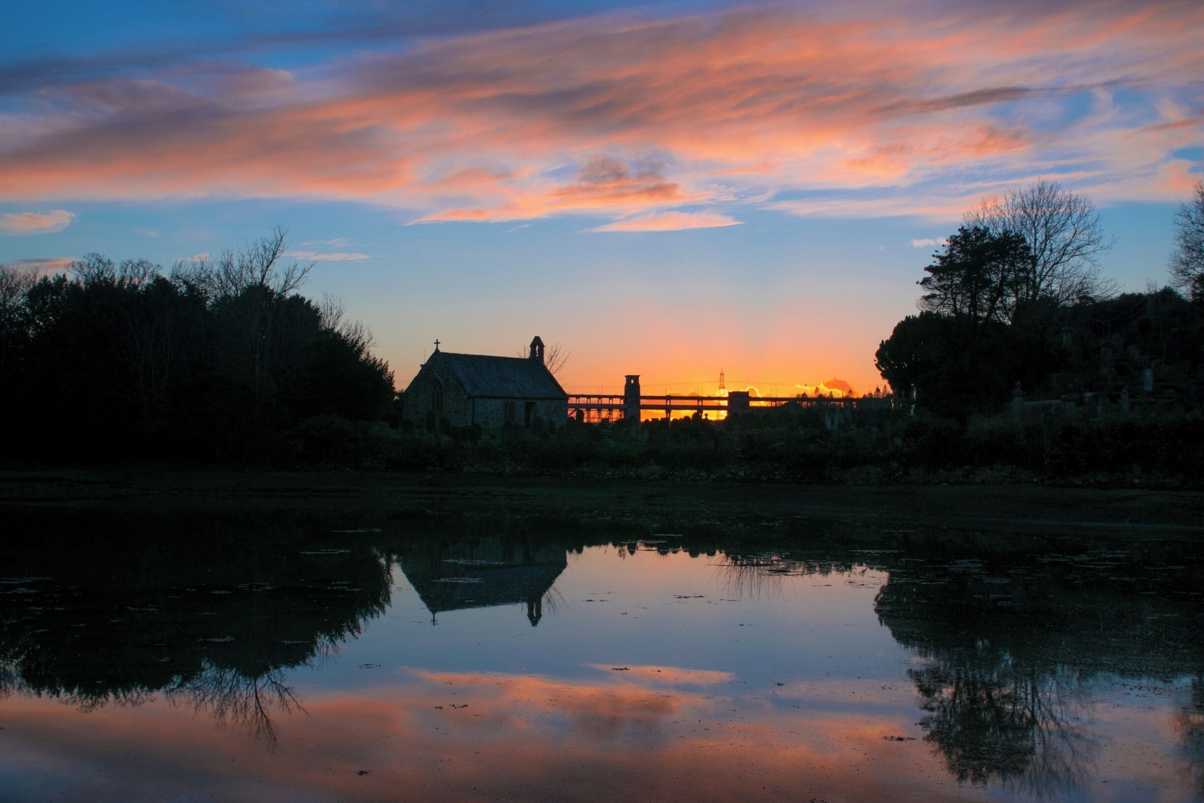 An oldie but a goodie - St Tysilio's Church in Menai Bridge, Anglesey from the Belgian Promenade. I lived 100yards from this location and made a mad dash from the house to grab this shot after work. That's the Britannia Bridge in the background, not reflected.

#menaibridge #anglesey #churchisland #northwales #church #island #reflection #sunset #welshsunset #BvSApplication 