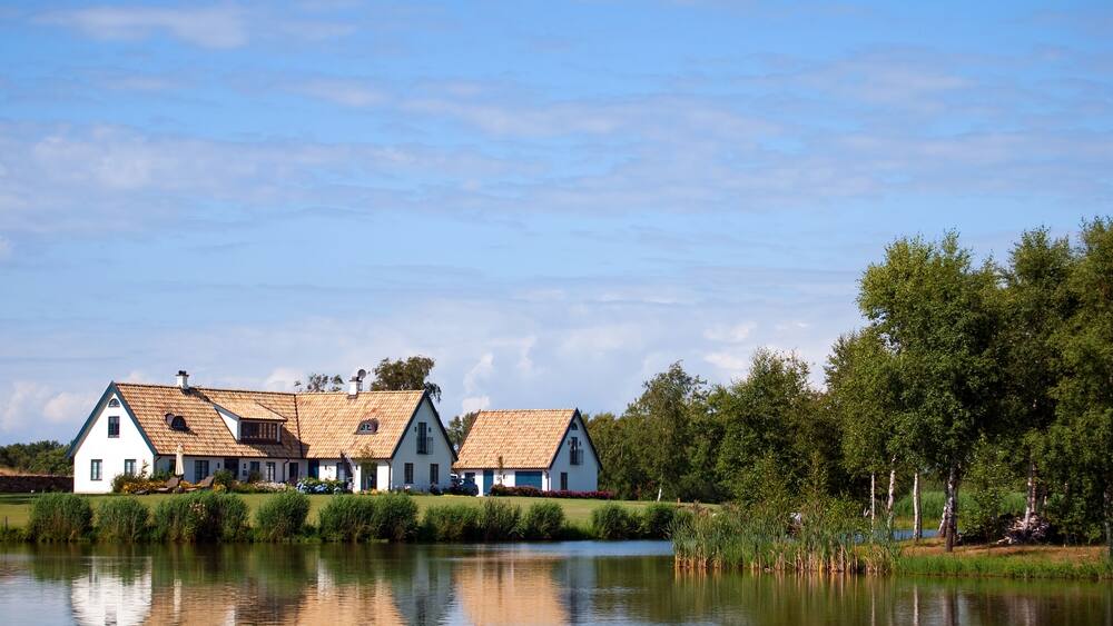 A view of a countryside lake with house near the swedish town of Torekov in the skane region of the country.