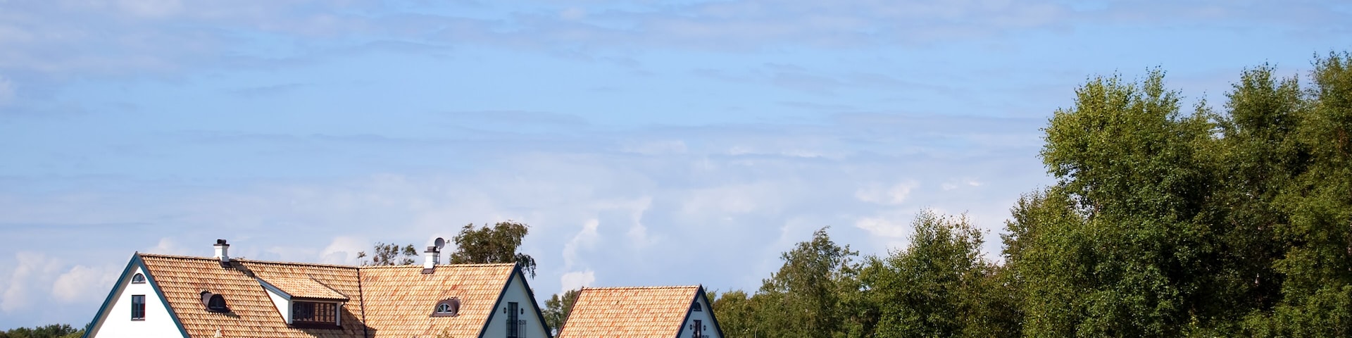 A view of a countryside lake with house near the swedish town of Torekov in the skane region of the country.