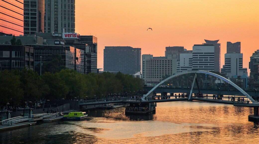 Yarra Riverfront which includes a bridge, a sunset and a river or creek