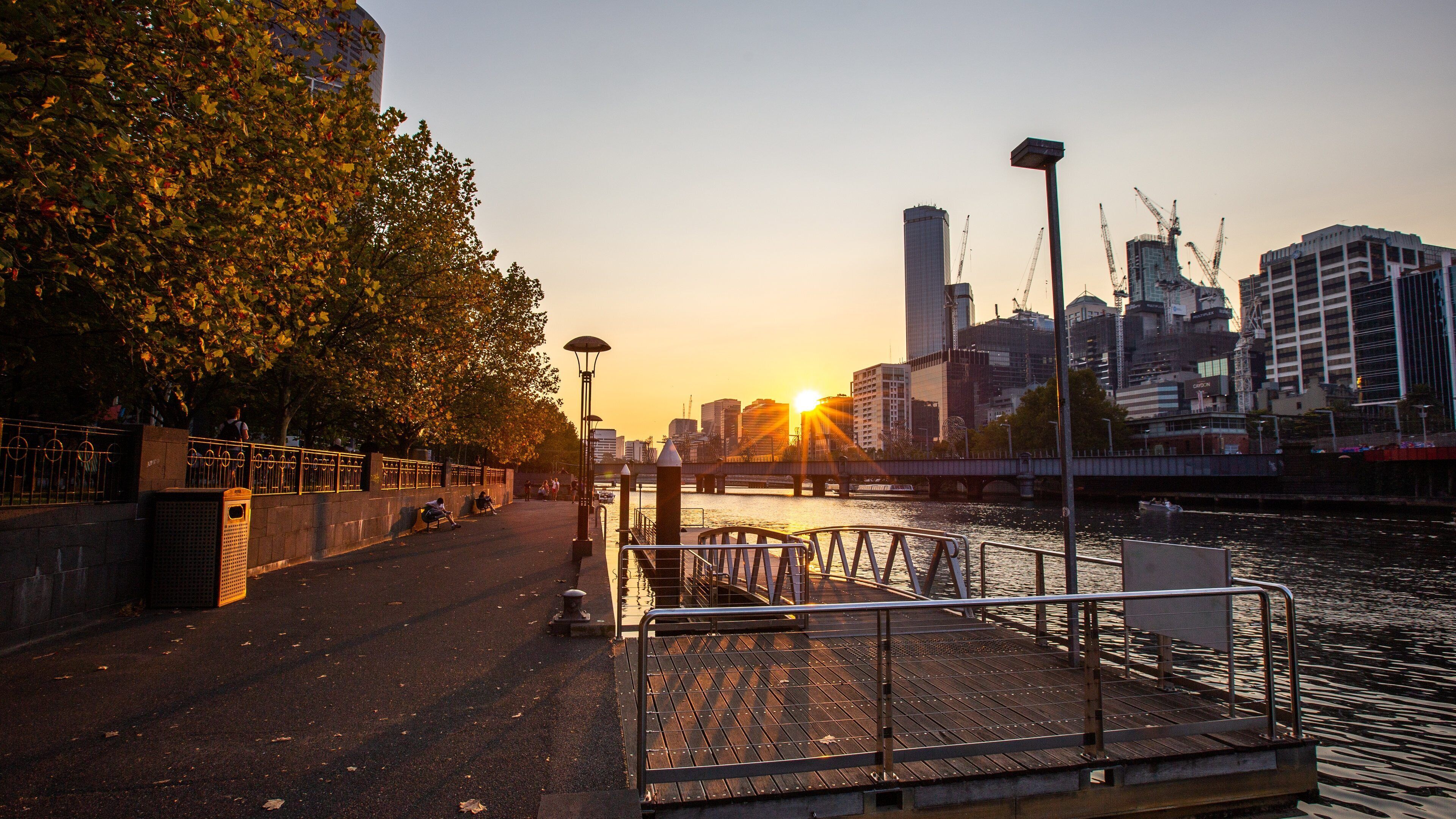 Yarra Riverfront featuring a river or creek, a city and a sunset