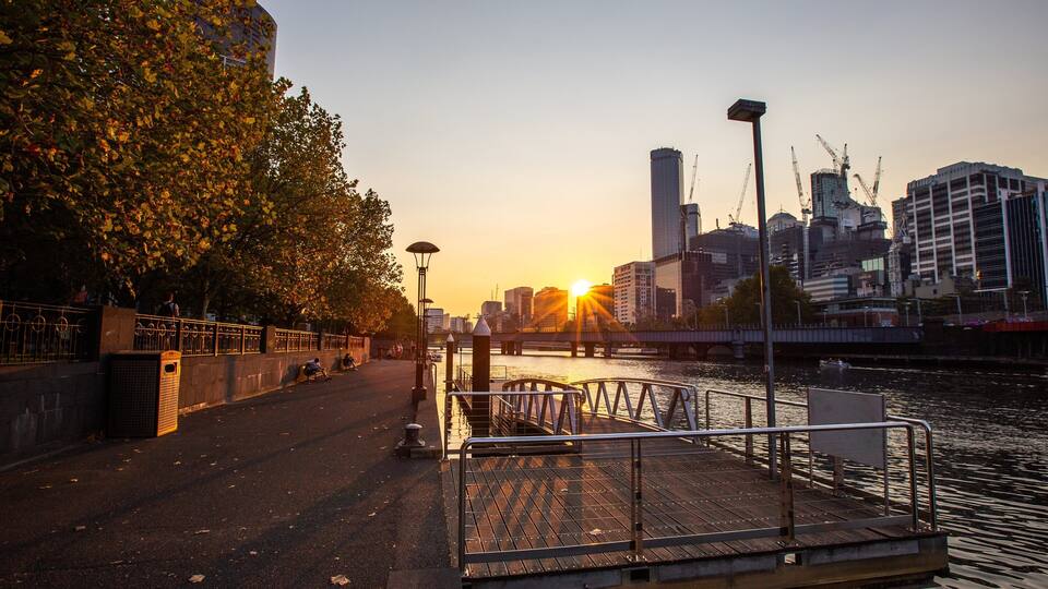Yarra Riverfront featuring a river or creek, a city and a sunset