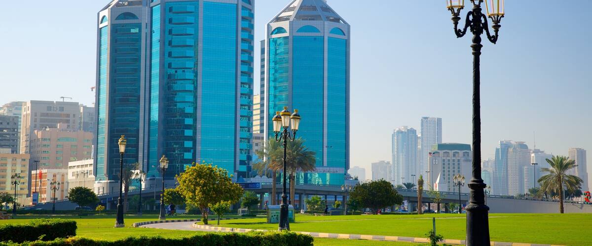 Sharjah showing a high rise building, a city and modern architecture