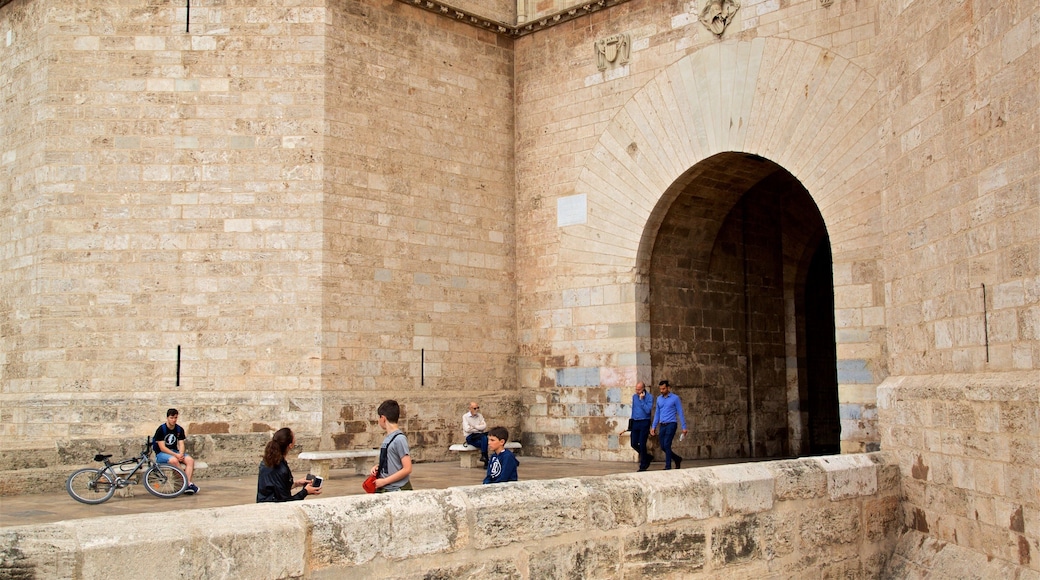 Serranos Towers showing heritage elements as well as a small group of people