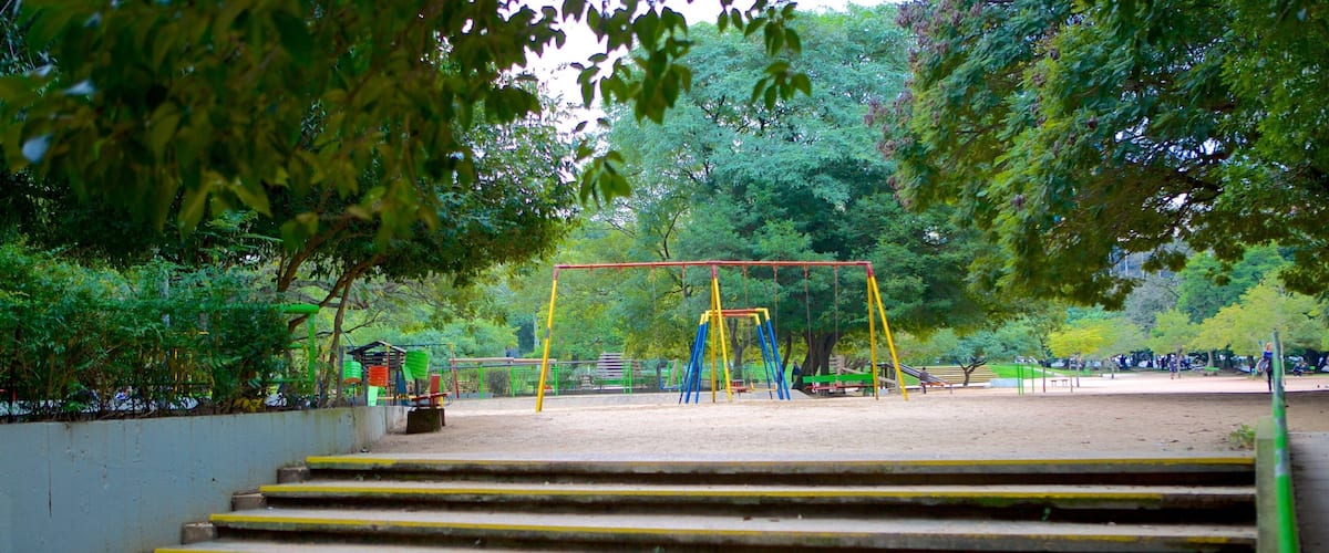 Moinhos de Vento Park featuring a playground and a garden
