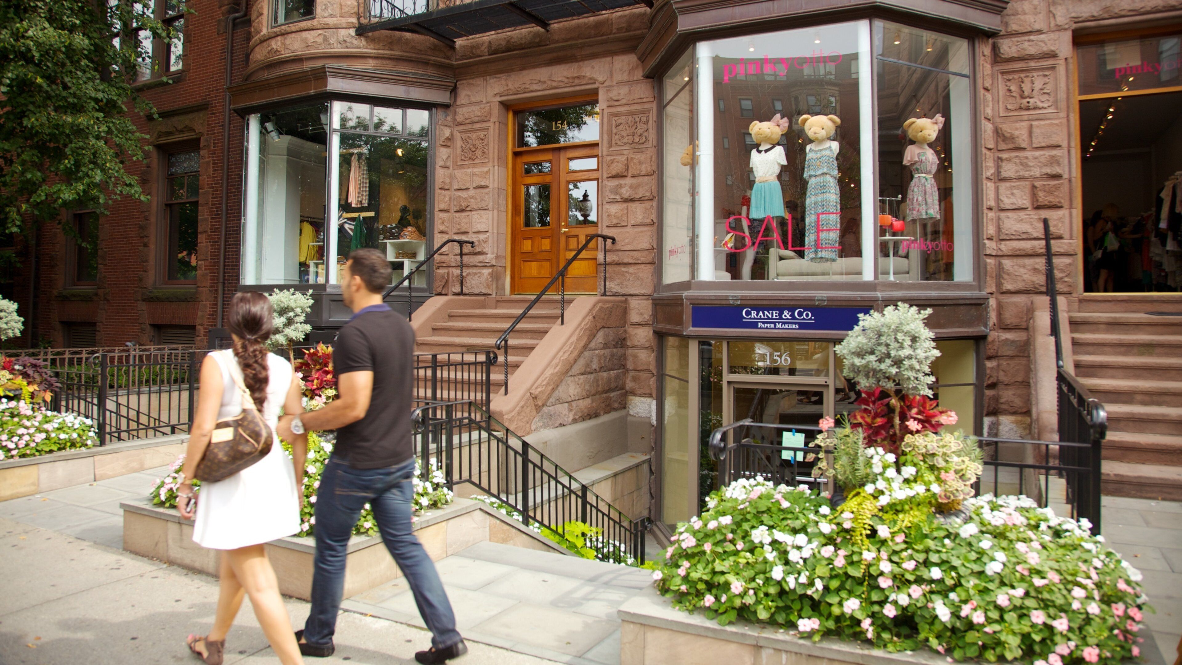 Newbury Street featuring wildflowers as well as a couple