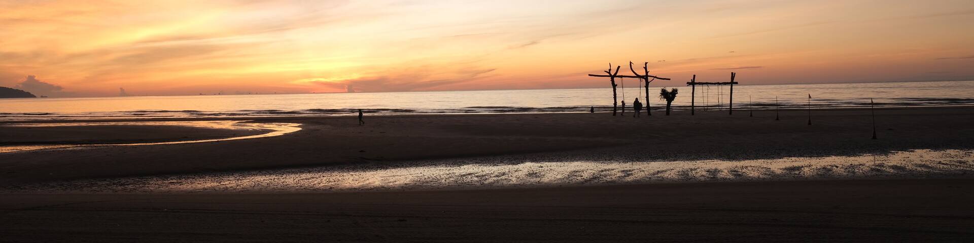A golden hour sunrise with light line at Pantai Balok, Kuantan.
