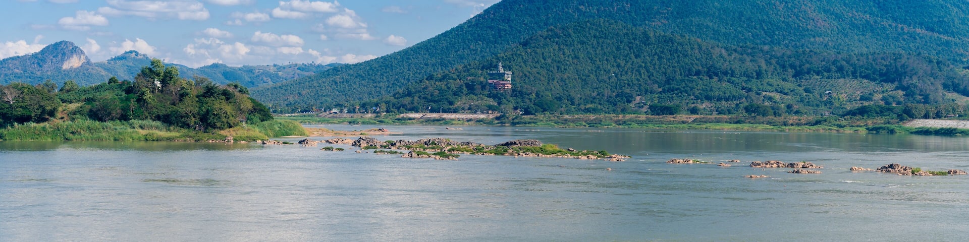 beautiful panorama landscape view of Kaeng Khut Khu (set of islets in the middle of Mae Khong River) with mountain, Mekong river and blue sky at Chiang Khan district, Loei province, Thailand
