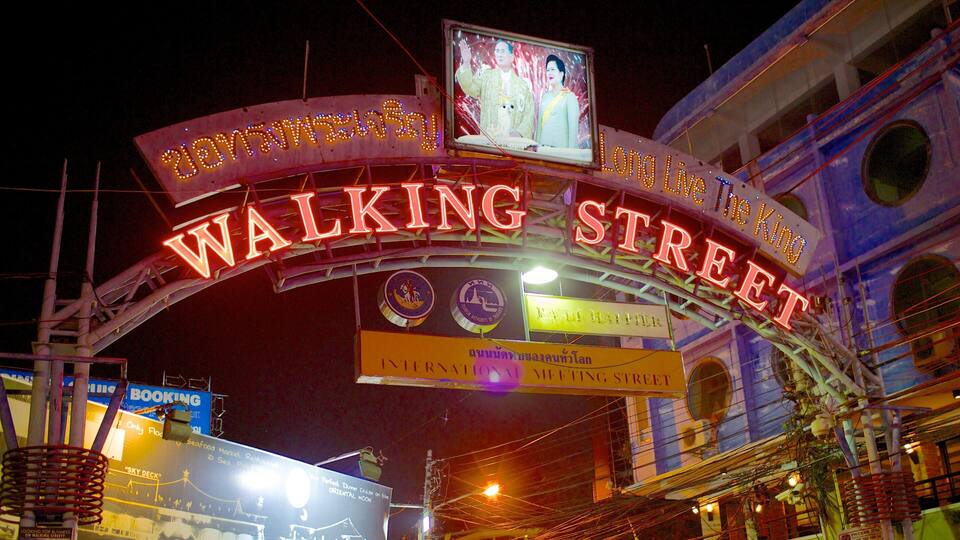 Neonbord voor Walking Street met verschillende bedrijfsaanduidingen eronder.