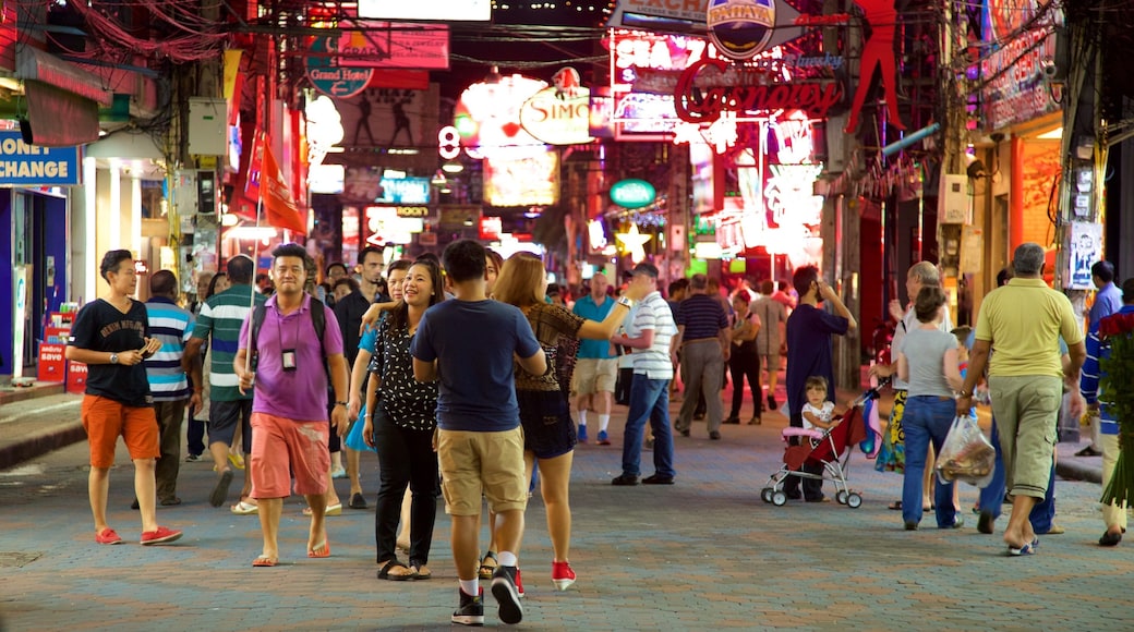 Walking Street featuring night scenes and markets as well as a large group of people
