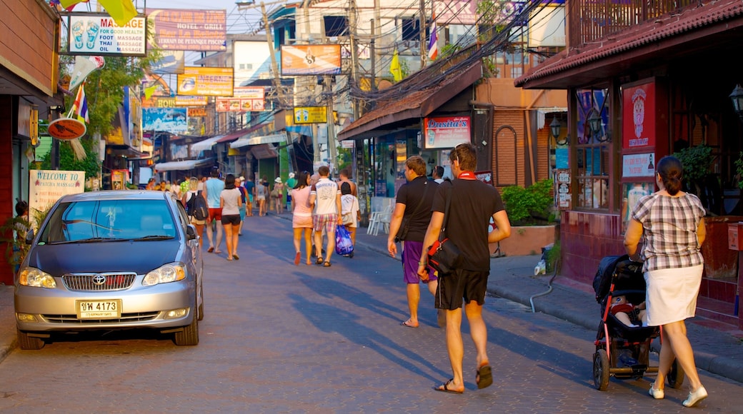 Walking Street showing street scenes and a city as well as a large group of people