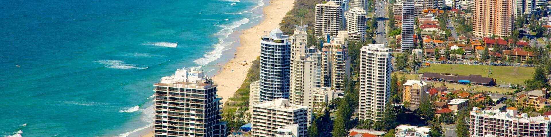 SkyPoint Observation Deck featuring a coastal town, a sandy beach and a high rise building