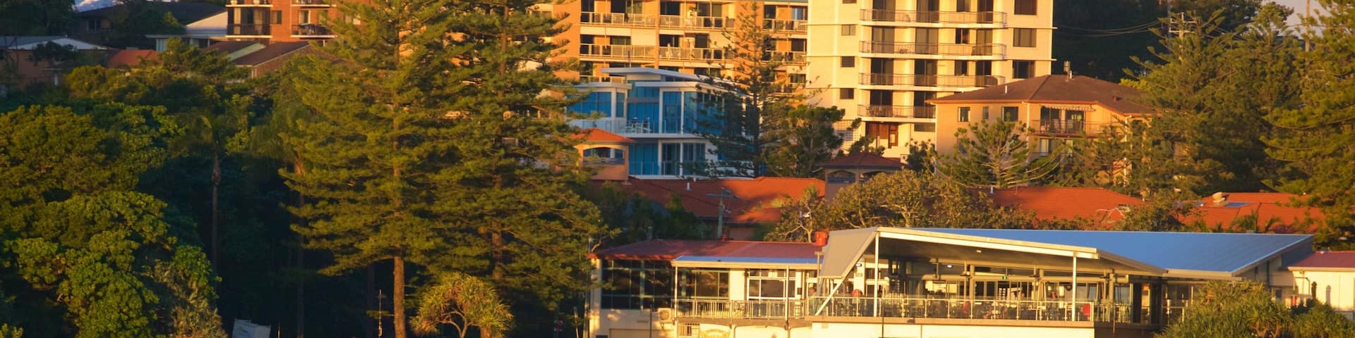 Coolangatta Beach showing a sunset, general coastal views and a coastal town