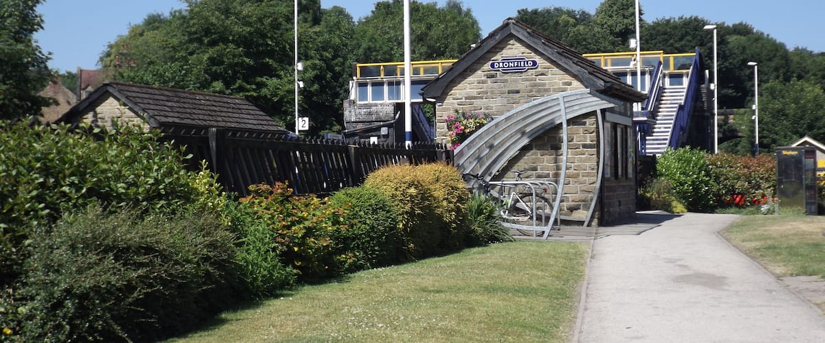 Station sign on Dronfield railway station platform shelter, South Yorkshire, England.